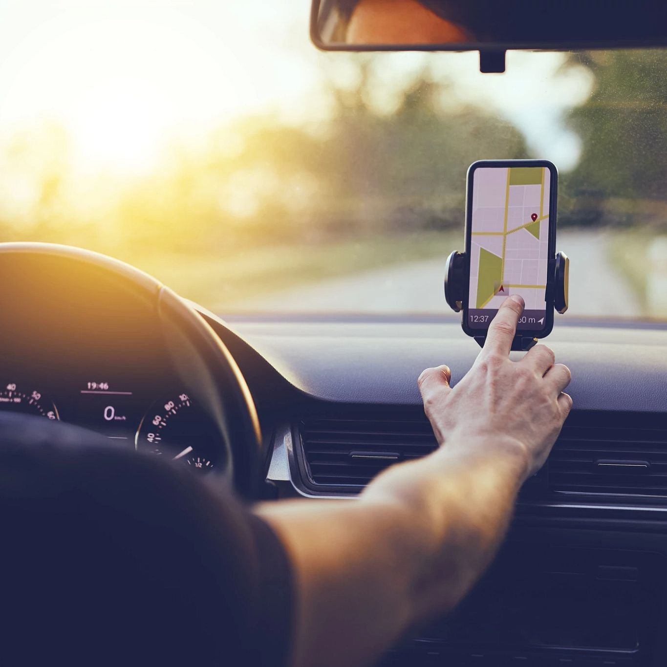 Person driving with gps on smartphone - Carpet City & Flooring Center in the Fairfield, CT area