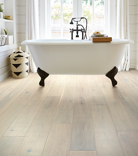 Bathroom with wood-look luxury vinyl flooring from Carpet City & Flooring Center in the Fairfield, CT area