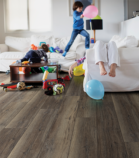 kids playing in room with wood-look laminate flooring from Carpet City & Flooring Center in the Fairfield, CT area